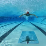 See Your Stroke, Fix Your Form: The Game-Changing Power Of Swimmirror HD swimmer legs under water for our article about: swimming leg movement