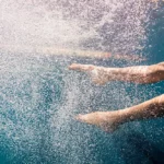 swimmer legs under water for our article about: swimming leg movement