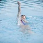 professional swimmer in the pool for the -what muscles does swimming work-article